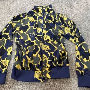 Ripndip Blue and Yellow Puffer Jacket with Bold Camouflage Pattern